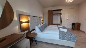 Postel nebo postele na pokoji v ubytování Hotel Kutzbach
