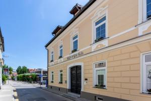 a building on the side of a street at Vila Slovenka in Celje