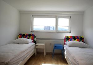 En eller flere senge i et værelse på Charming Terrace Apartments Ana and Maria Tour As Ljubljana