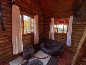 Posezení v ubytování Cabana do Lago