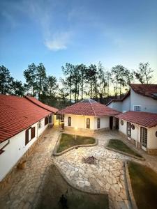 an aerial view of a house with red roofs at Vale - Suítes Exclusivas (Bairro Nobre) in São Lourenço