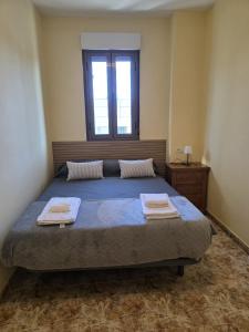 Ένα ή περισσότερα κρεβάτια σε δωμάτιο στο Casa Alba