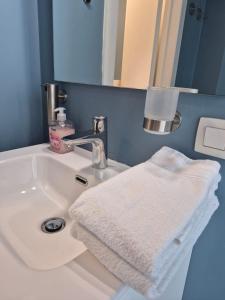 a bathroom with a white towel on a sink at Dokstudio50 in Ghent +36 photos