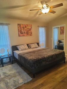a bedroom with a bed and a ceiling fan at Entire home Private swim pool Quiet area in Jacksonville