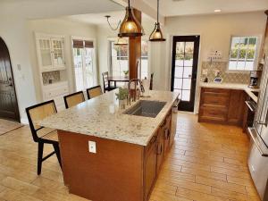 a kitchen with a sink and a counter top at Belmont Shore Beach House - Incredible Oceanfront Views in Long Beach +34 photos