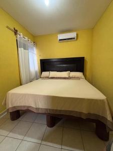 En eller flere senge i et værelse på Mundo feliz