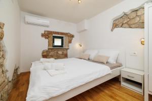 Postel nebo postele na pokoji v ubytování Niluma