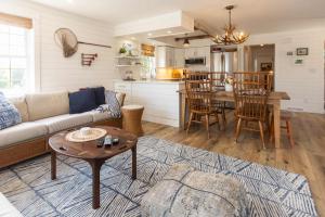 a living room with a couch and a table at Heaven on Earth 2 BDR Fontana Flat Walk to Lake in Lake Geneva