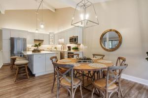 a kitchen and dining room with a table and chairs at Abbey Springs - Private Community & Amenities in Lake Geneva
