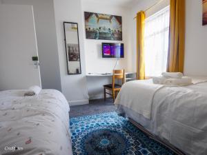 Un pat sau paturi într-o cameră la Cornwallis House