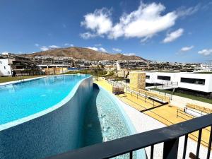 a view of a swimming pool on a balcony at Camporosso Serpentine Duplex in Finestrat