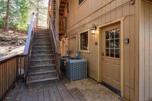a staircase leading up to a house with a door at Yosemite Quail - Nestled in with a View in Yosemite West