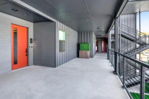 an empty hallway of an office building with a staircase at Pacific Island Inspired Stay - Amazing Location in New Braunfels