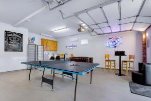 a ping pong table in the middle of a room at Spacious Retreat & Game Room - Sleeps 8 in New Braunfels
