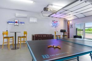 a ping pong room with a ping pong table at Spacious Retreat & Game Room - Sleeps 8 in New Braunfels +29 photos