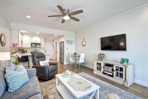a living room with a couch and a tv at La Costa Gem - Condo for 3 in Carlsbad