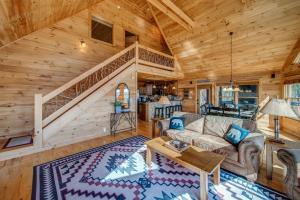 a living room with a couch and a staircase at Get Away to Blue Ridge with Magical Views in Epworth