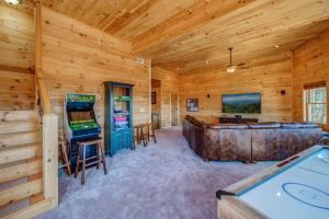 a log cabin with a pool table and arcade games at Get Away to Blue Ridge with Magical Views in Epworth