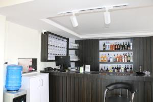 a bar with a blue water bottle on the counter at Hotel Bharosa Inn in Kathmandu +17 photos