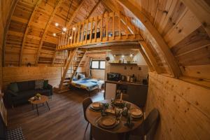 an overhead view of a living room and kitchen in a log cabin at Javorje24 chalets in Žabljak
