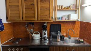 a kitchen with a sink and a counter top at Résidence Horizon E - deux pièces 5 pers plein SUD Horizon 1800 MAE-6211 in Orcières +5 photos