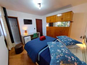 Ένα ή περισσότερα κρεβάτια σε δωμάτιο στο Pousada Casa Verde - Curitiba