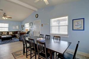 a dining room and living room with a table and chairs at Spacious & Pet Friendly - Game Room Sleeps 10 in Port Aransas
