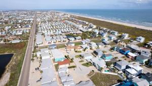 an aerial view of a city and the beach at Fun 2 bedroom - Pets Pool Sleeps 6 in Port Aransas