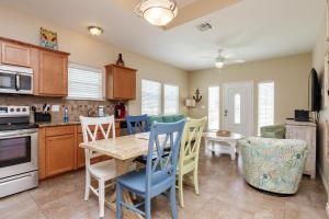 a kitchen and dining room with a table and chairs at Fun 2 bedroom - Pets Pool Sleeps 6 in Port Aransas