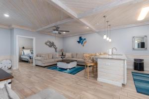 a living room with a couch and a table at Modern Comfort 3 Bedroom Pets in Port Aransas