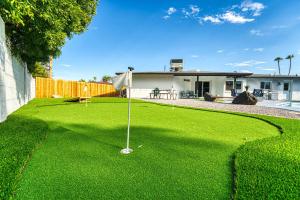 a putting green with a golf ball on it at 3BR Sleeps 8 Pool Putting Green BQQ Large Island in Scottsdale
