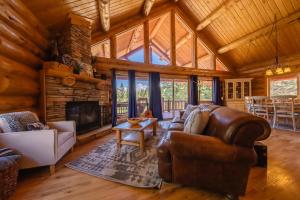 a living room with a couch and a fireplace at Maggies Cabin - Enjoy a Slice of Paradise in Rexford Montana in Rexford
