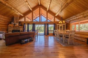 a living room with a couch and a table at Maggies Cabin - Enjoy a Slice of Paradise in Rexford Montana in Rexford +27 photos