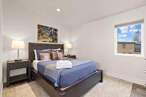 a bedroom with a bed and a window at Whitefish All Seasons Getaway in Whitefish +14 photos