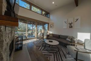 a living room with a couch and a fireplace at Wilderness Club Cabin - Sleeps 7 in Eureka