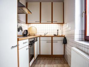Kuchyň nebo kuchyňský kout v ubytování "Spitzhausblick" in het Huis Felix