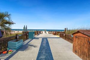 a walkway to the beach with the ocean in the background at 1BR Sleeps 5 at The Summit with Ocean Front Views in Panama City Beach