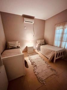 Ένα ή περισσότερα κρεβάτια σε δωμάτιο στο Casa fin de semana +8 φωτογραφίες