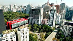 an aerial view of a city with tall buildings at Travel Inn Premium Flats Paulista Wall Street in Sao Paulo