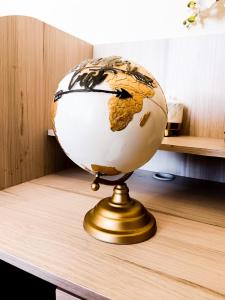 a globe on top of a wooden table at Dalia Room, Paseo Durango in Durango