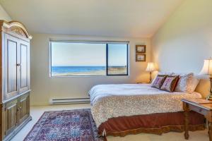 a bedroom with a bed and a large window at Neel Nirvana - Deck With BBQ & Community Pool in Sea Ranch +24 photos