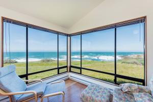 a living room with a view of the ocean at Haltwhistle West With Ocean Views in Sea Ranch