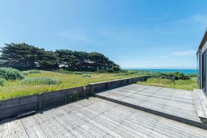 a wooden boardwalk leading down to a beach at Haltwhistle West With Ocean Views in Sea Ranch