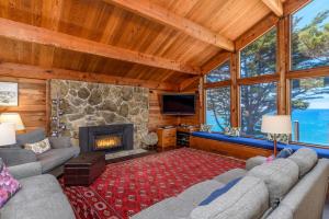 a living room with couches and a fireplace at Haven's View With Stunning Ocean Views in Gualala +27 photos