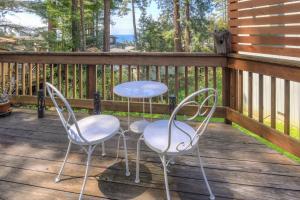 two chairs and a table on a deck at Searenity by the Sea - Private Hot Tub in Gualala