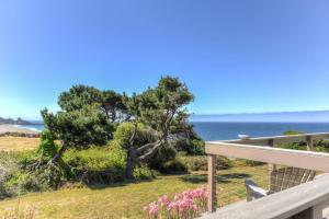 a view of the ocean from the deck of a house at Lucky Ewe - Ocean View Retreat in Gualala