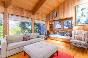 a living room with a couch and a bed at Beautiful Family Home for 6 with Hot Tub in Redwoods in Sea Ranch
