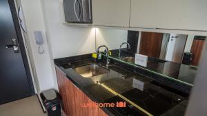 ครัวหรือมุมครัวของ Studio em Vila Mariana com coworking no prédio
