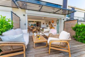 Les Griselles 3 Hauts Baie Orientale - Appart 1ch 4p vue MER的休息区