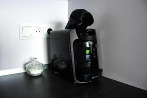 a coffee maker sitting on top of a counter at MK Apartments PP in Poprad +10 photos